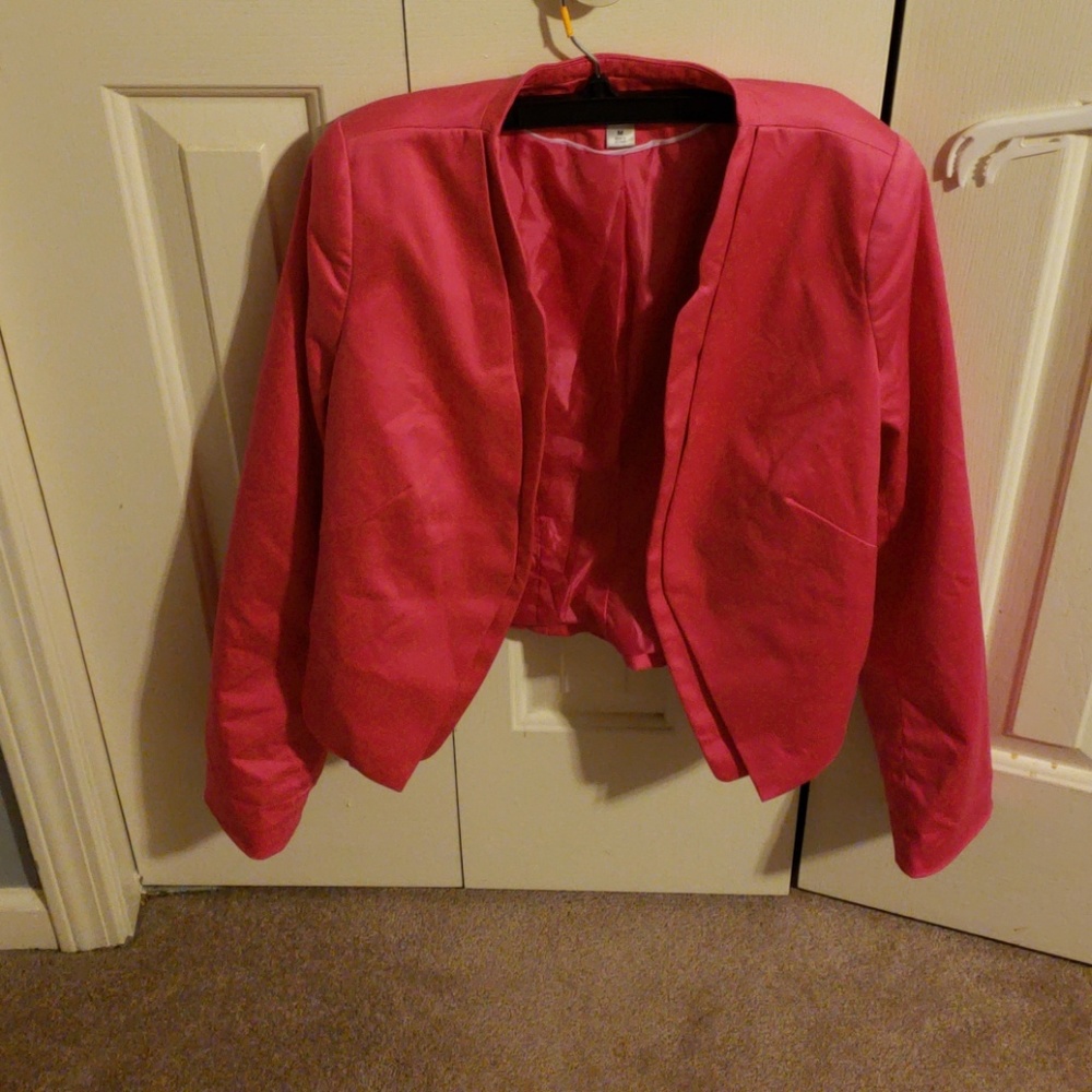 Pink blazer with padded shoulders